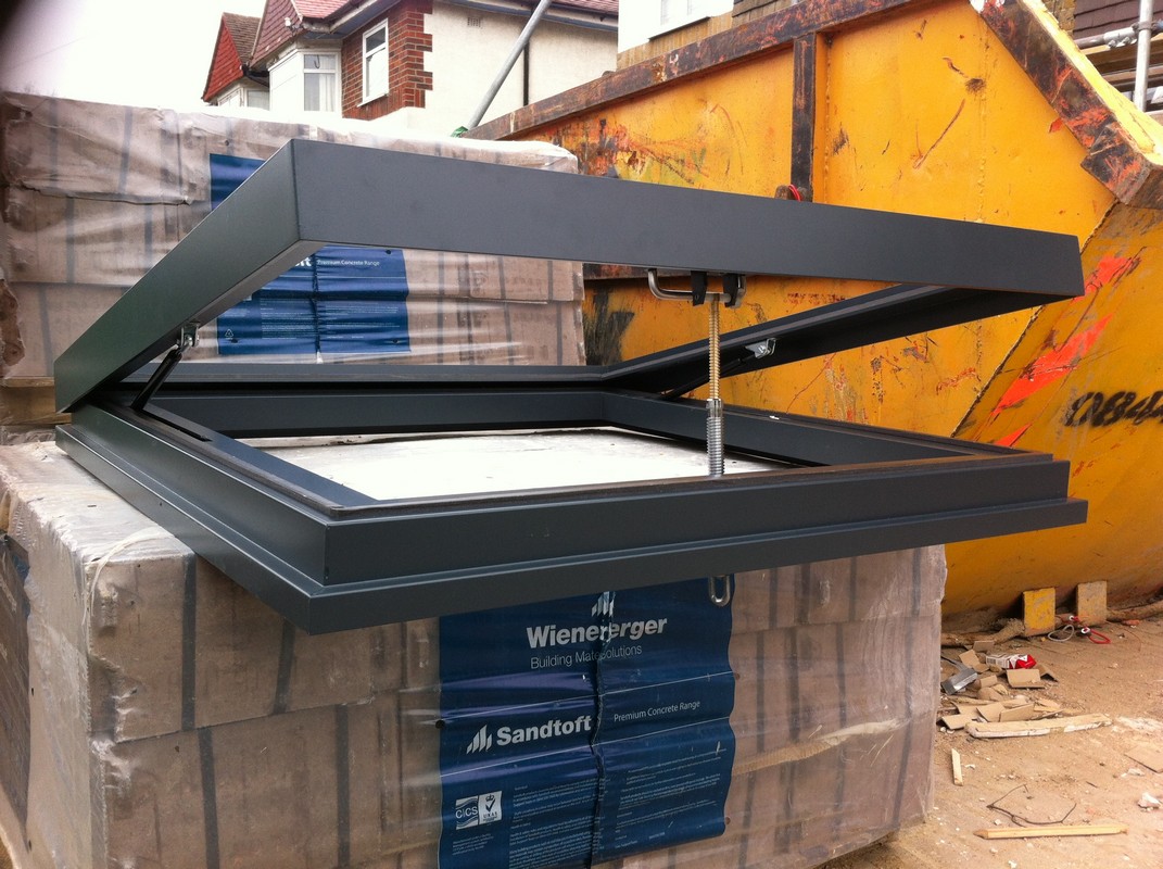 Opening flat roof skylight in anthracite grey installed in Stockwell